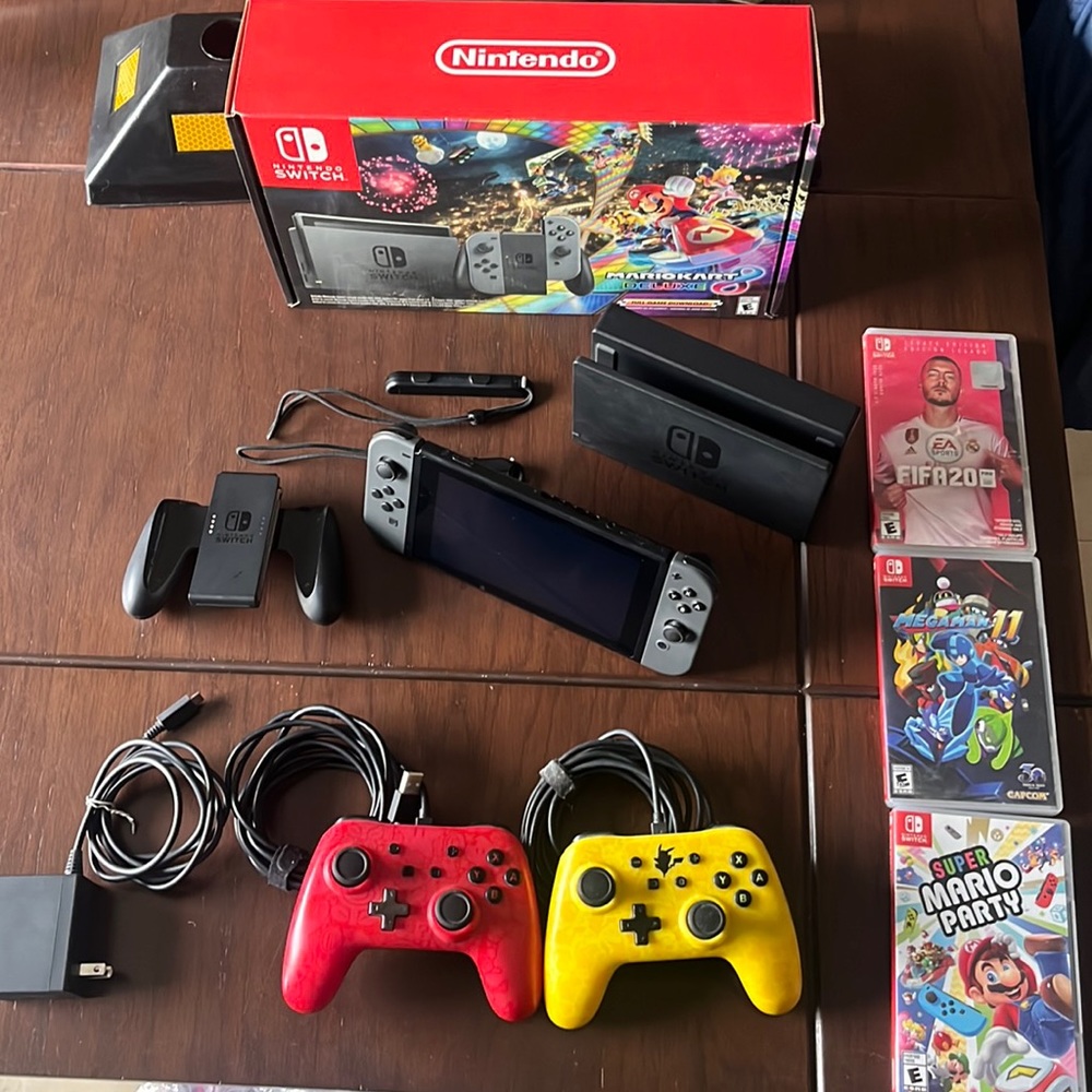 Nintendo Switch MARIO KART DELUXE gently used with wired controllers, and games